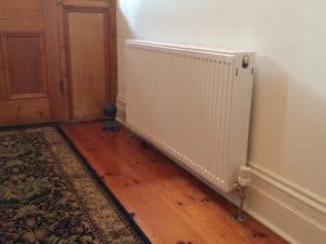 Hydronic wall mounted radiator retrofitted in a home in Adelaide