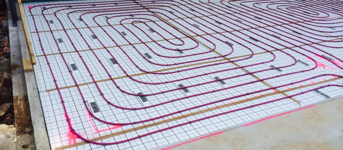 Hydronic underfloor and radiator heating with geoexchange